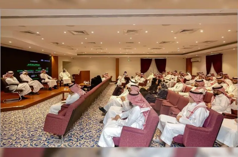 A panel session room, the speakers on stage facing the audience